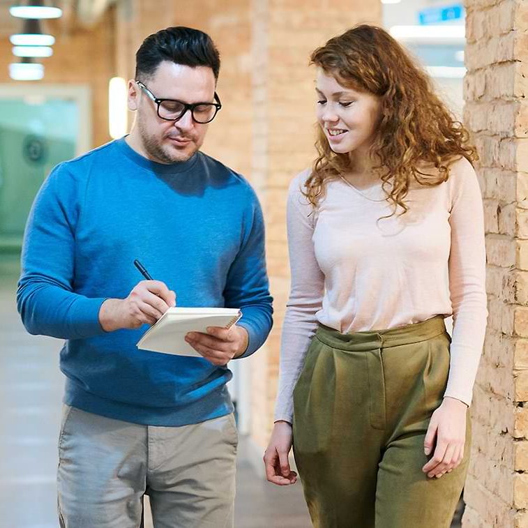 Two People Walking and Talking